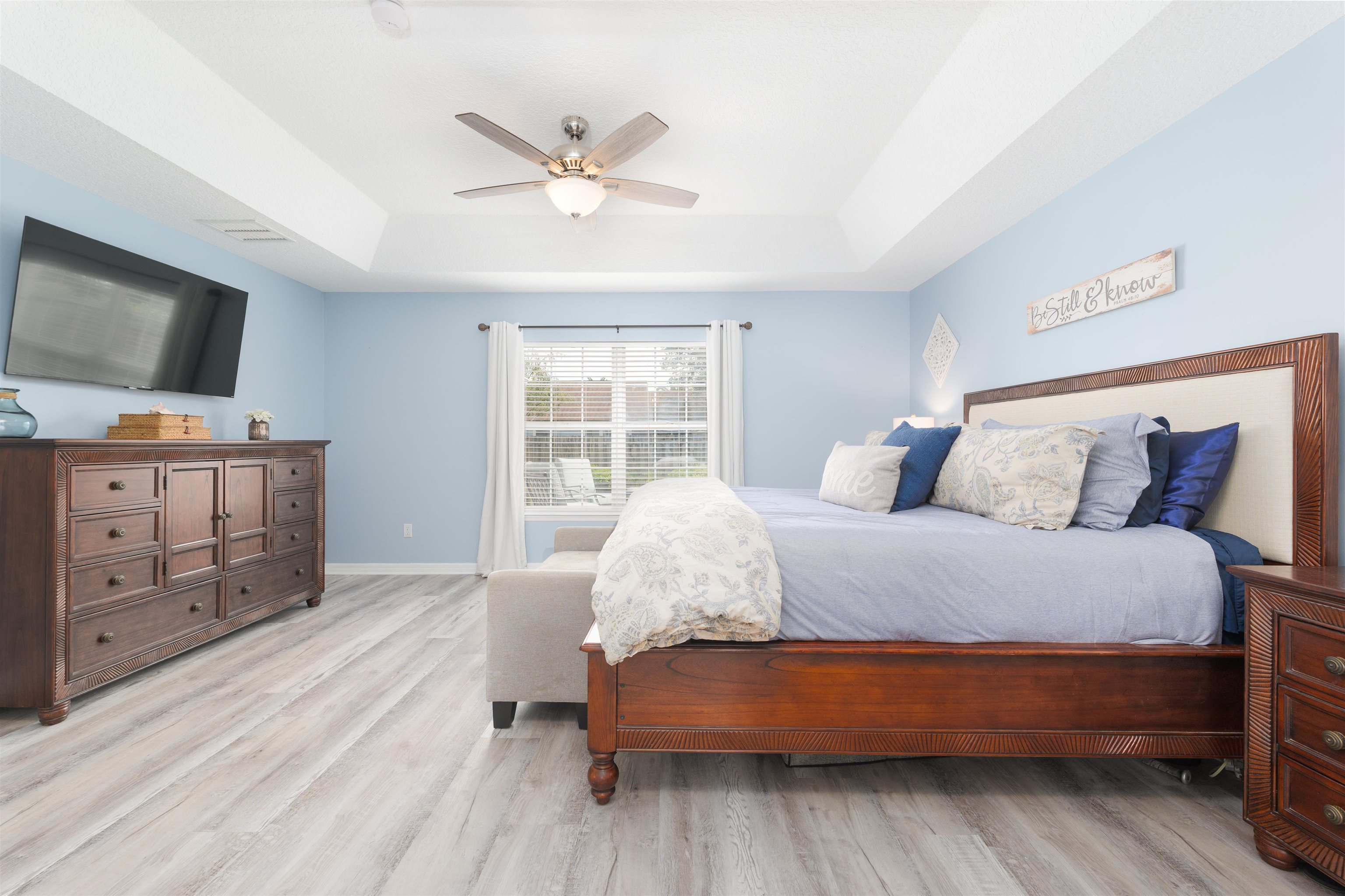 5324 5th Street St. Augustine, FL 32080 - Photo 28 of 45 a bedroom with a bed and wooden floor