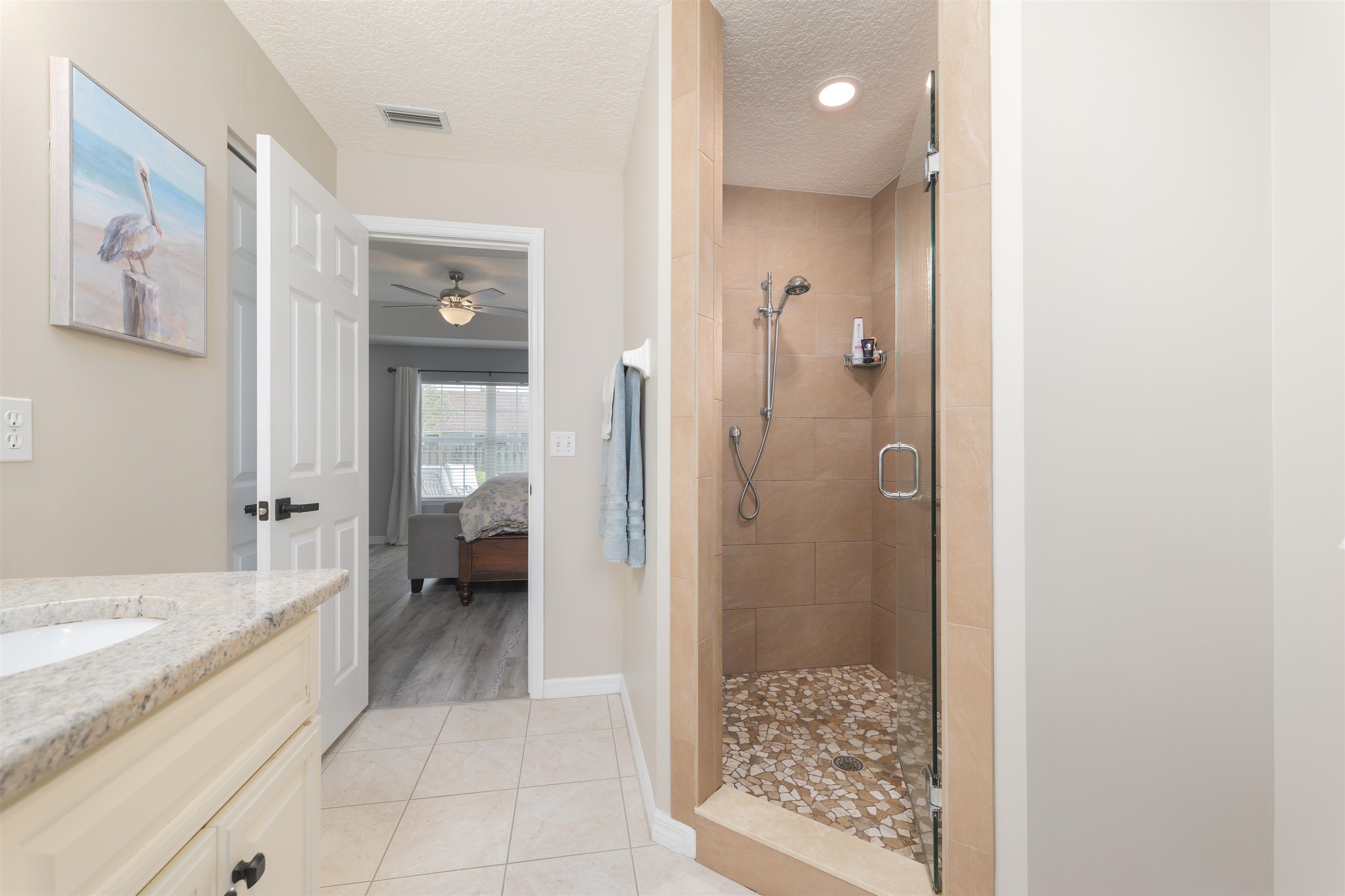 5324 5th Street St. Augustine, FL 32080 - Photo 29 of 45 a bathroom with a tub shower and a sink