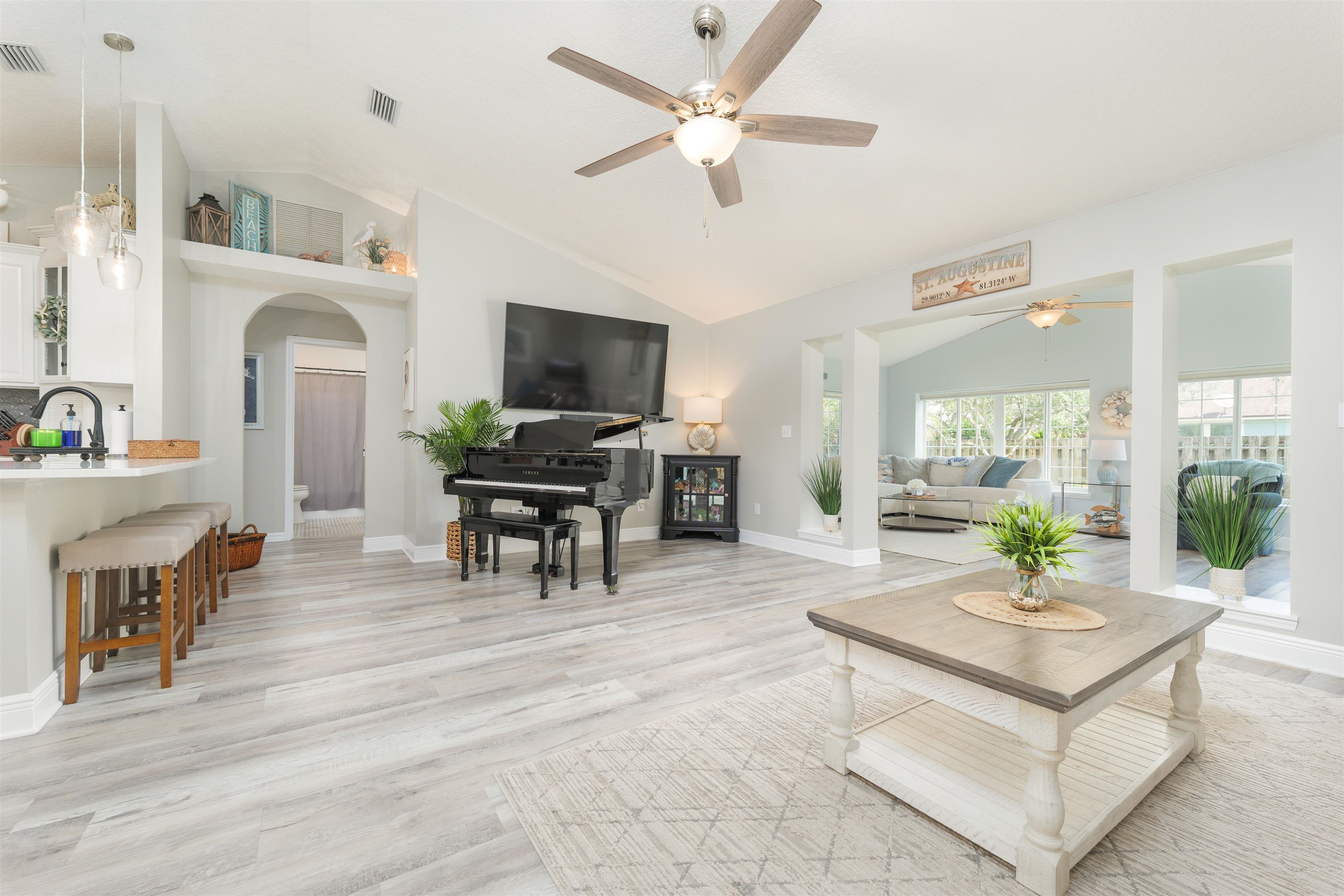 5324 5th Street St. Augustine, FL 32080 - Photo 30 of 45 a living room with fireplace furniture and a flat screen tv