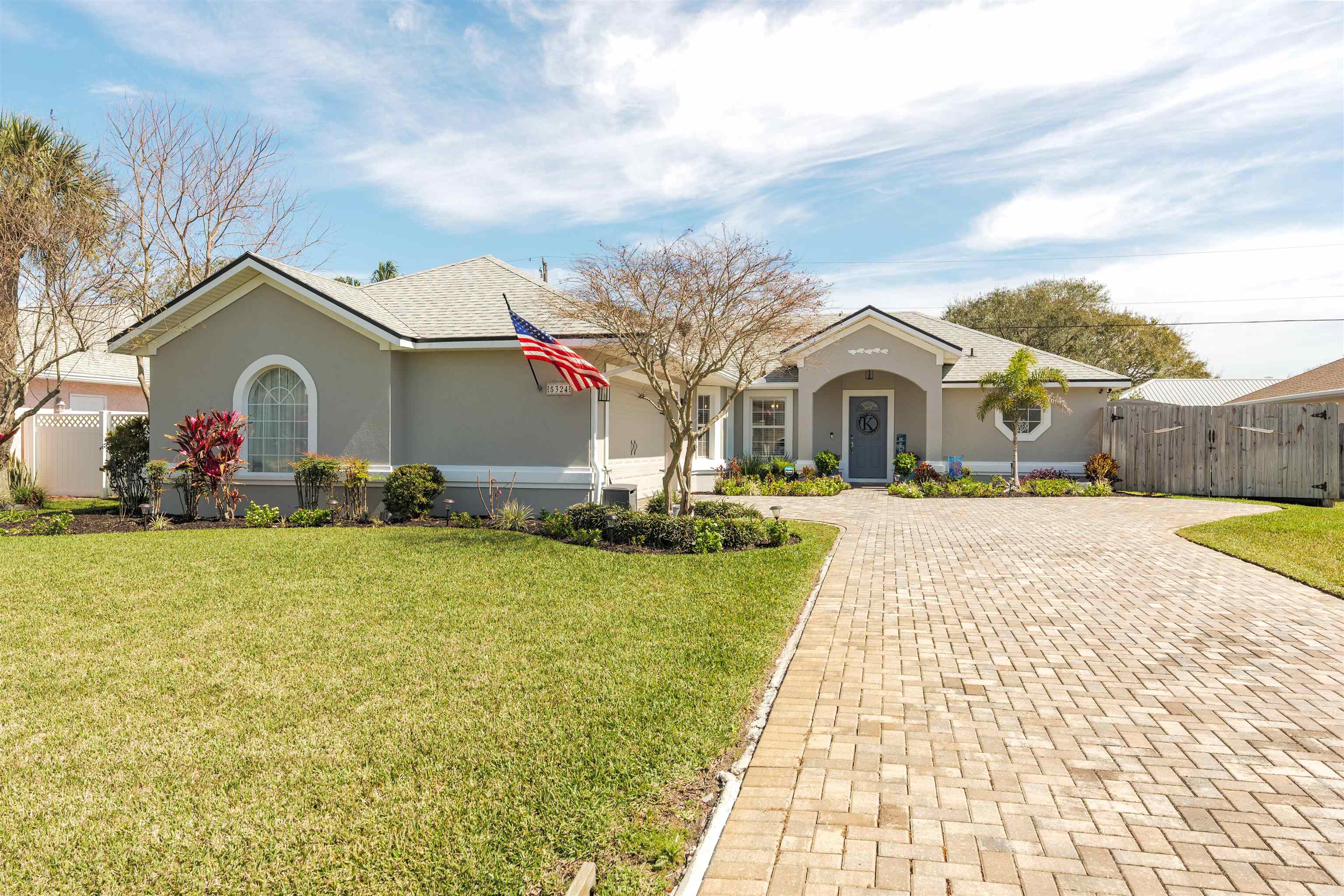 5324 5th Street St. Augustine, FL 32080 - Photo 3 of 45 a front view of house with yard and trees around