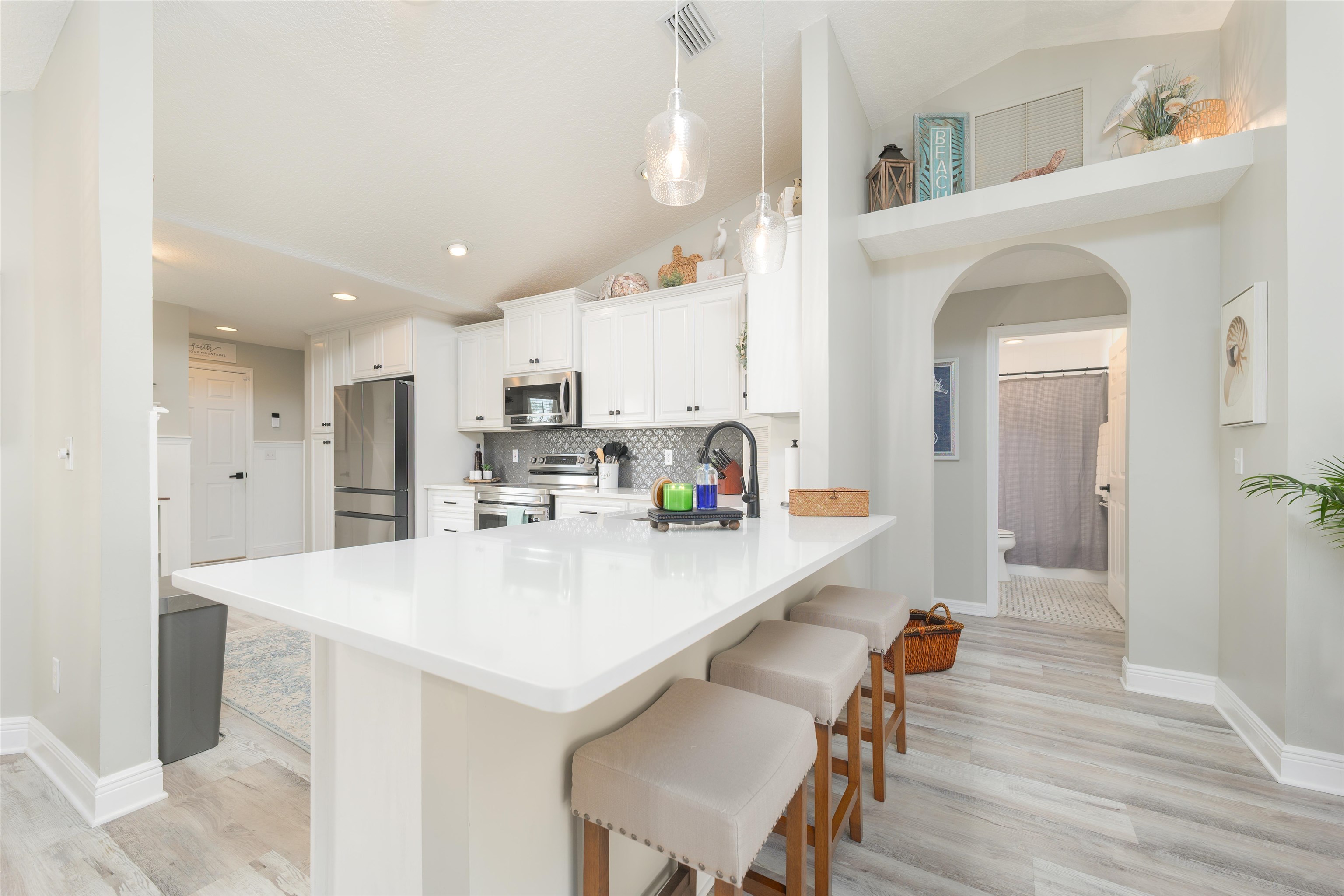 5324 5th Street St. Augustine, FL 32080 - Photo 32 of 45 a large white kitchen with a table and chairs
