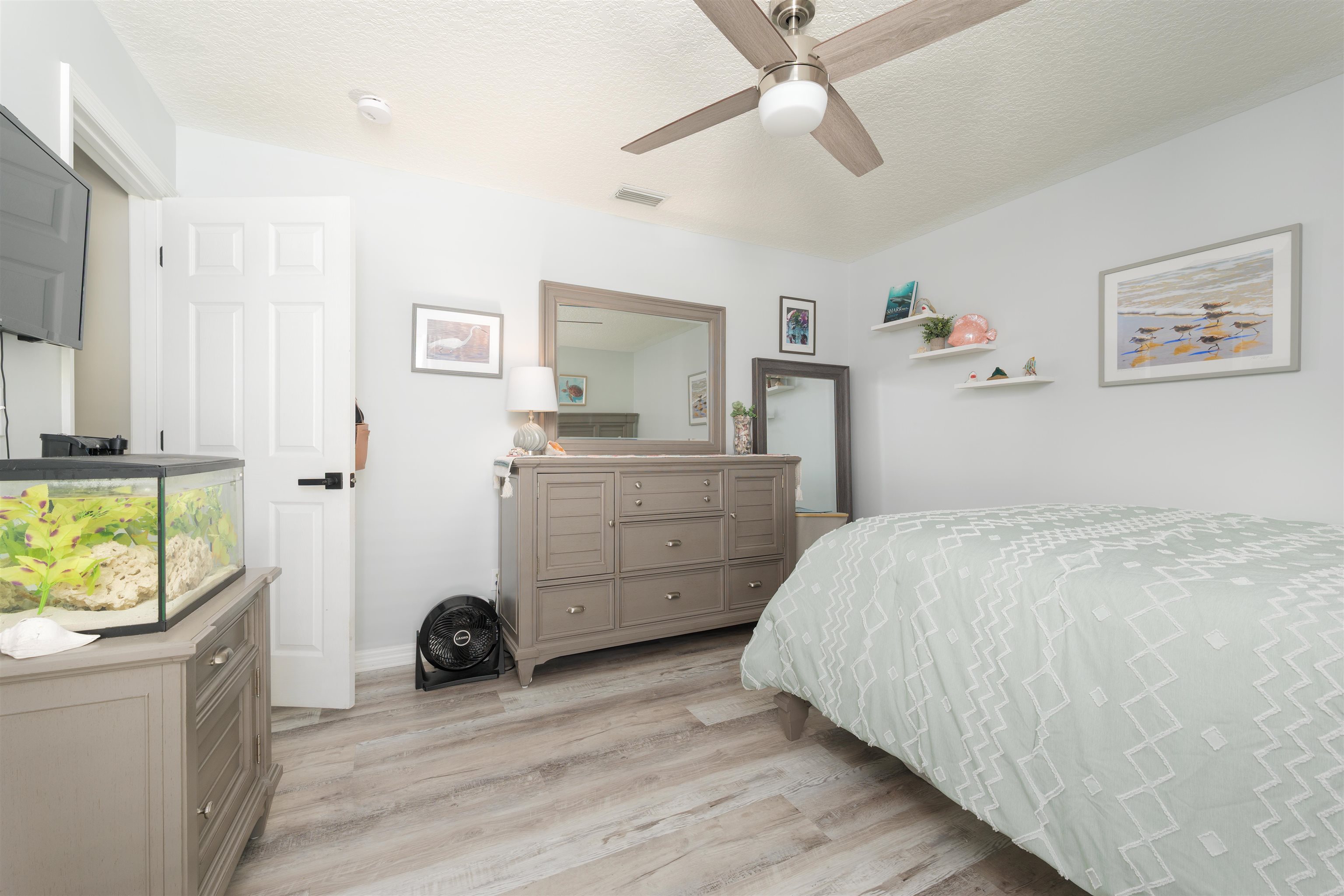 5324 5th Street St. Augustine, FL 32080 - Photo 43 of 45 a bedroom with a bed and a view of kitchen