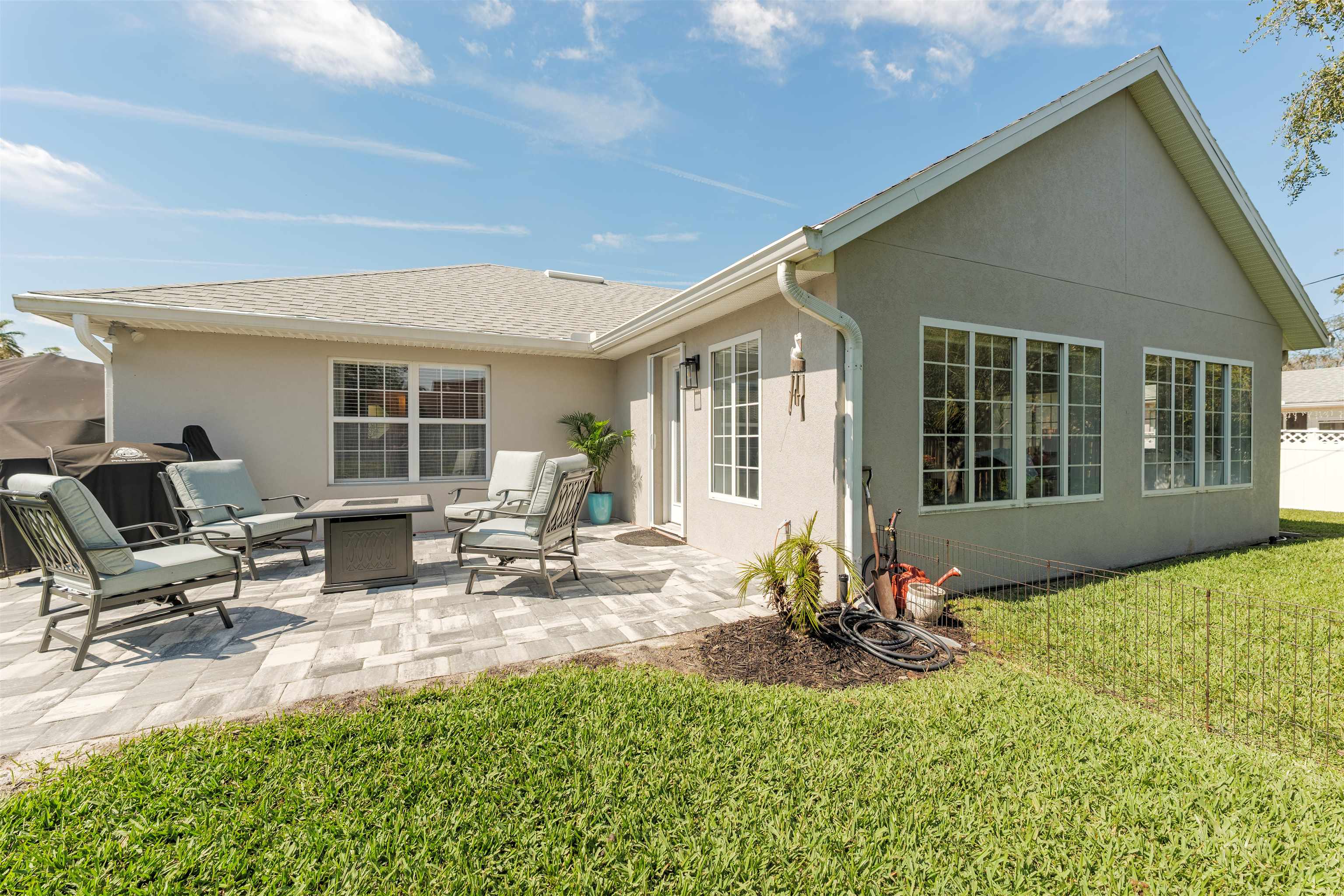 5324 5th Street St. Augustine, FL 32080 - Photo 8 of 45 a view of a patio with table and chairs and potted plants