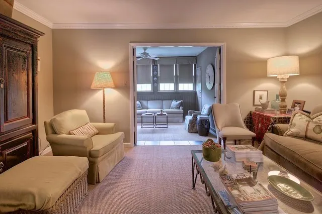 a living room with furniture and a lamp