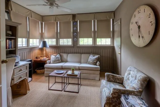 a living room with furniture and a fireplace