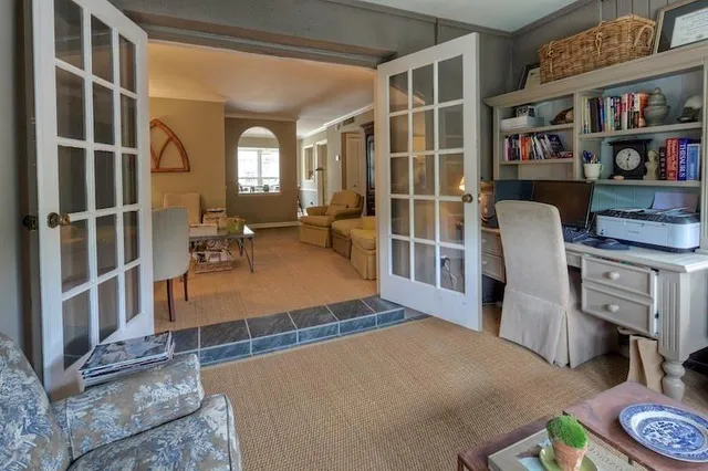 a bedroom with furniture and a window