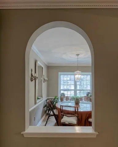 a living room with furniture and windows