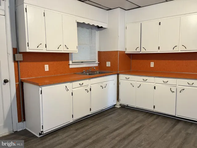 a view of cabinets with wooden floor