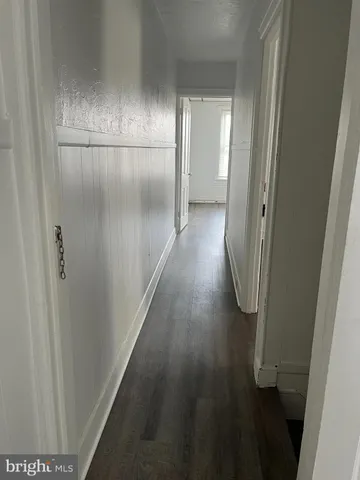 a view of gallery with wooden floor