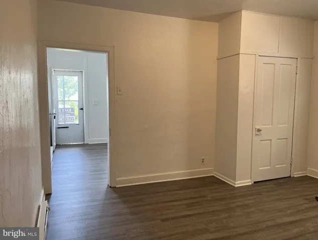 a view of a livingroom with wooden floor