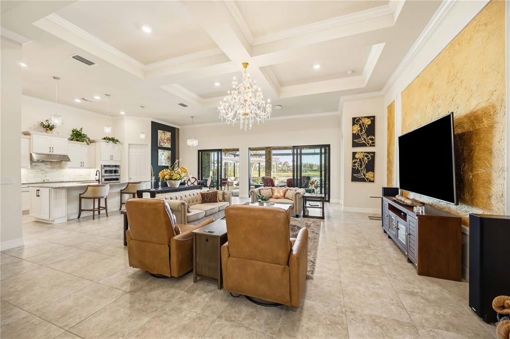 13349 Verandi Street Venice, FL 34293 - Photo 13 of 76 a living room with fireplace furniture and a flat screen tv