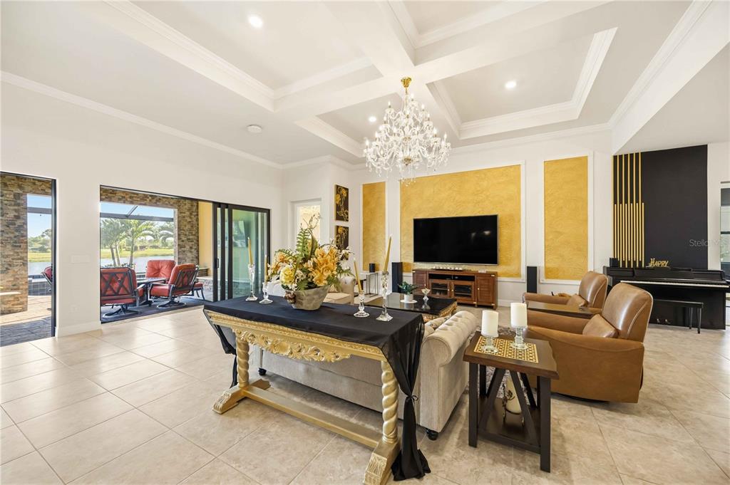 13349 Verandi Street Venice, FL 34293 - Photo 14 of 76 a living room with furniture and a flat screen tv