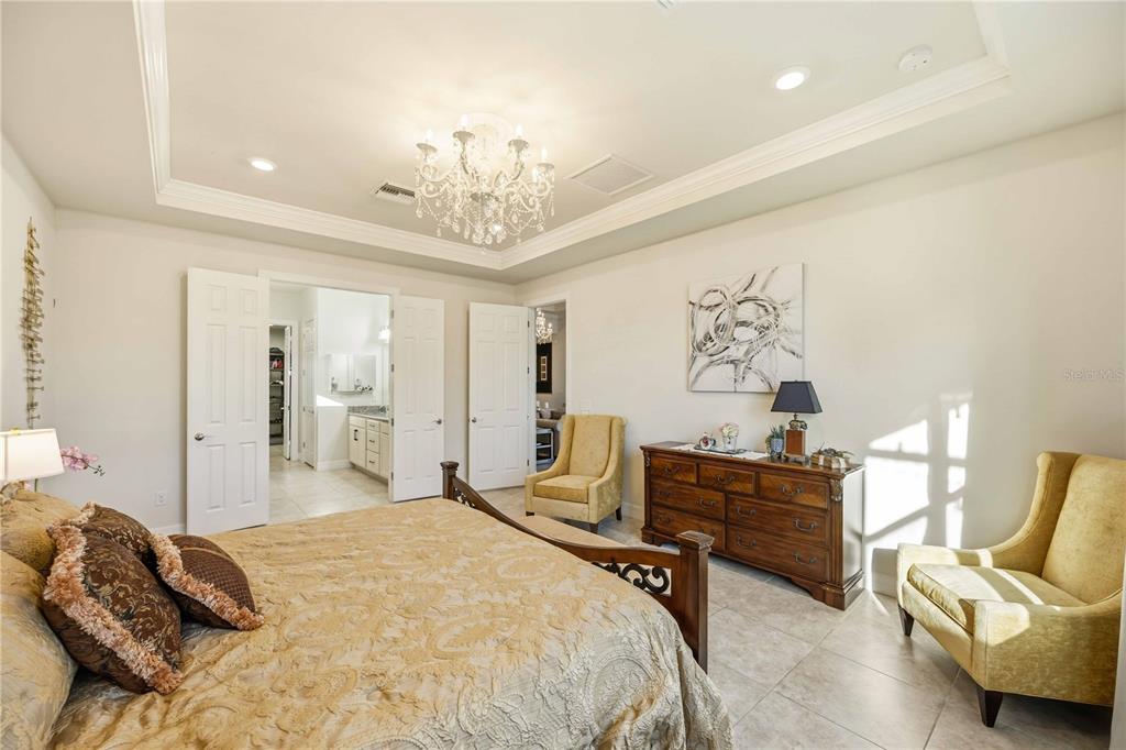 13349 Verandi Street Venice, FL 34293 - Photo 18 of 76 a bedroom with a bed and furniture