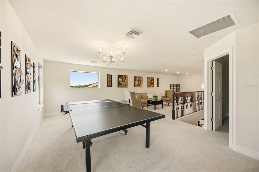 13349 Verandi Street Venice, FL 34293 - Photo 27 of 76 a living room with furniture and a table