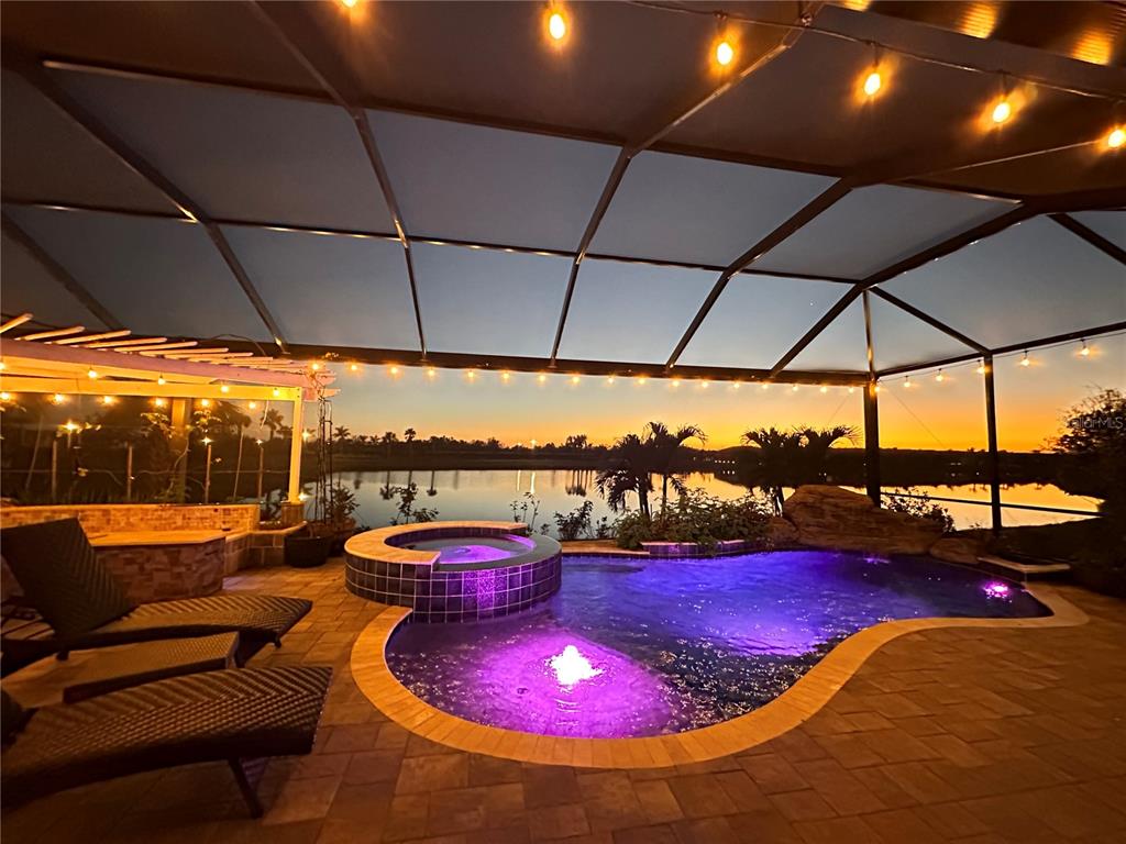 13349 Verandi Street Venice, FL 34293 - Photo 3 of 76 a view of a swimming pool with a chairs and a table