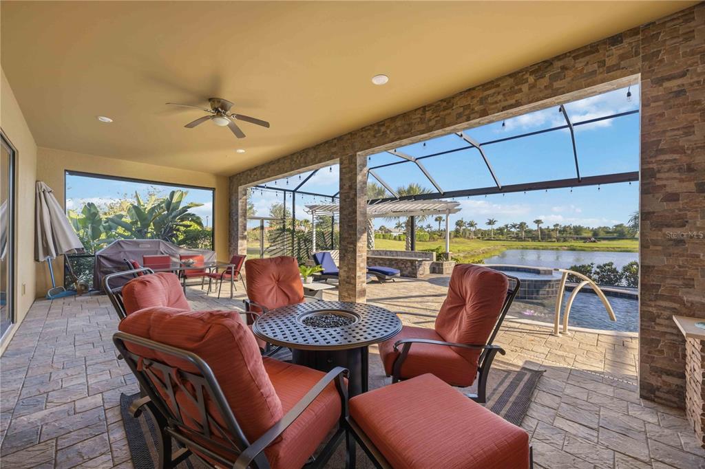 13349 Verandi Street Venice, FL 34293 - Photo 38 of 76 a outdoor space with patio the couches and chairs with wooden floor