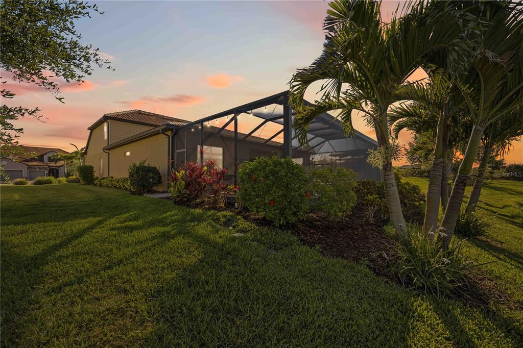 13349 Verandi Street Venice, FL 34293 - Photo 45 of 76 a backyard of a house with lots of green space