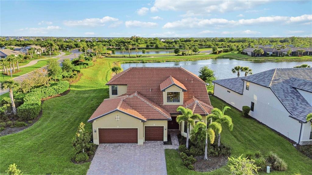 13349 Verandi Street Venice, FL 34293 - Photo 51 of 76 a view of a lake with a house in the background