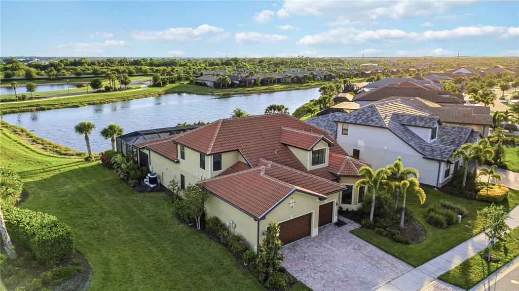 13349 Verandi Street Venice, FL 34293 - Photo 52 of 76 an aerial view of a house with a lake view