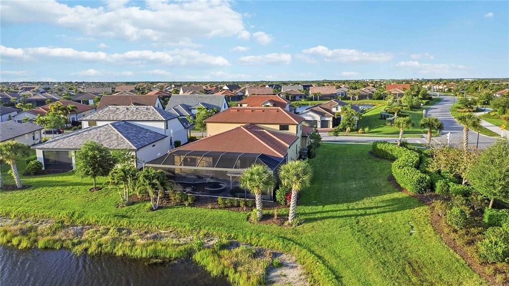 13349 Verandi Street Venice, FL 34293 - Photo 54 of 76 an aerial view of a house with a garden
