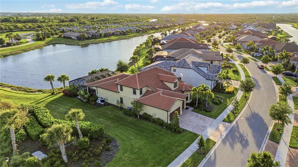 13349 Verandi Street Venice, FL 34293 - Photo 55 of 76 an aerial view of residential houses with outdoor space and lake view