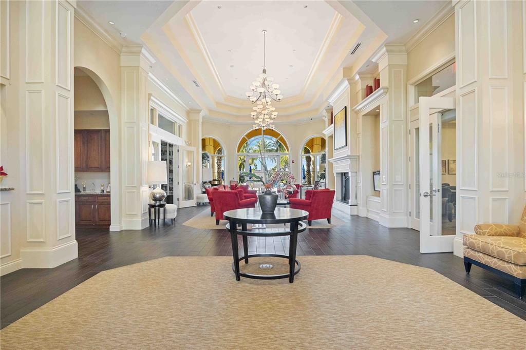 13349 Verandi Street Venice, FL 34293 - Photo 60 of 76 a living room with fireplace furniture and a chandelier