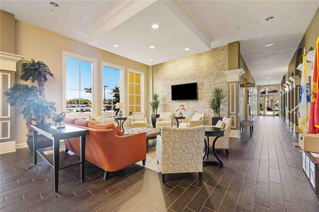 13349 Verandi Street Venice, FL 34293 - Photo 67 of 76 a living room with furniture and a flat screen tv