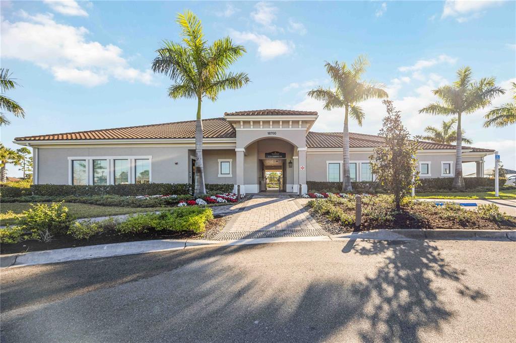 13349 Verandi Street Venice, FL 34293 - Photo 72 of 76 a front view of a house with a garden and a tree