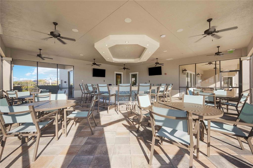 13349 Verandi Street Venice, FL 34293 - Photo 75 of 76 a very nice looking open dining room with kitchen view and a view of living room