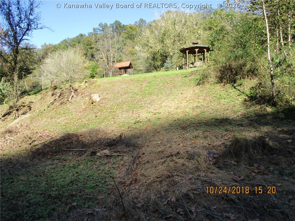 754 Little Italy Road Ivydale, WV 25113 - Photo 26 of 26 View from flat on the river looking up to Gazebo and well.