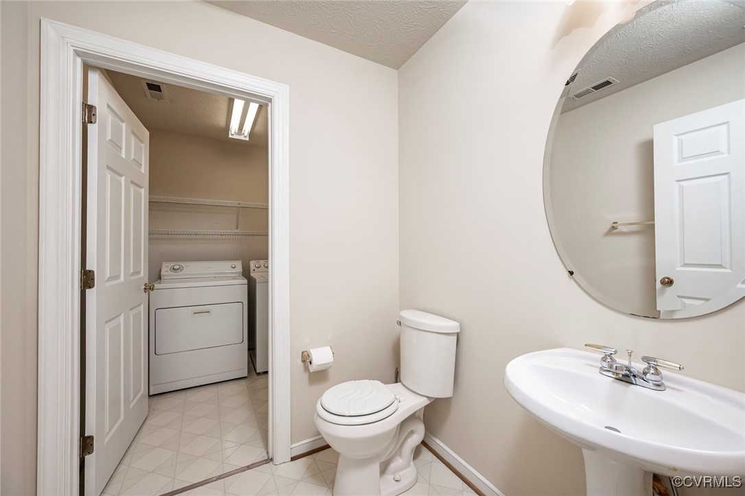 13819 Bluff Ridge Drive Chesterfield, VA 23838 - Photo 25 of 45 First Floor Powder room leading to Utility room wi