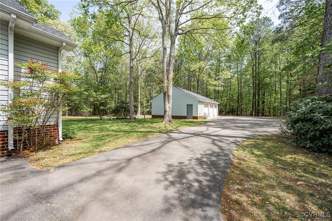 13819 Bluff Ridge Drive Chesterfield, VA 23838 - Photo 41 of 45 View of detached garage and paved drive rear of pr