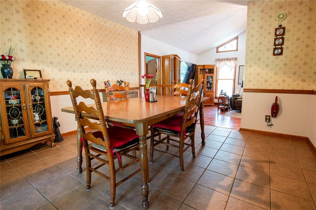 2966 Riviera Drive Conyers, GA 30012 - Photo 25 of 63 a dining room with furniture and wooden floor