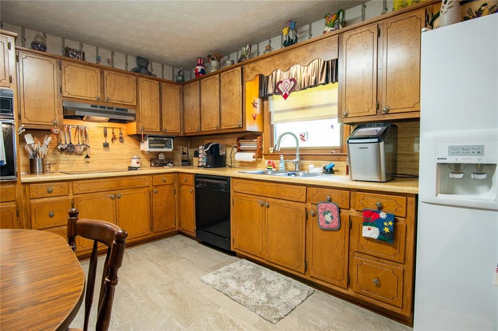2966 Riviera Drive Conyers, GA 30012 - Photo 28 of 63 a kitchen with stainless steel appliances granite countertop a refrigerator and a sink