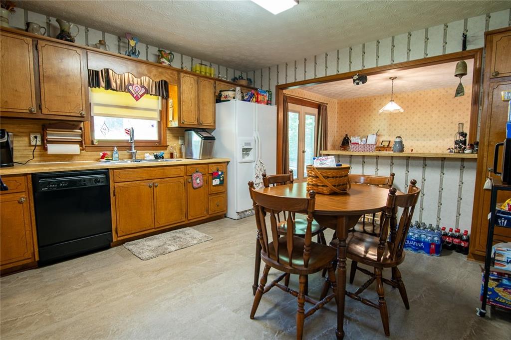2966 Riviera Drive Conyers, GA 30012 - Photo 29 of 63 a dining table with chairs and window