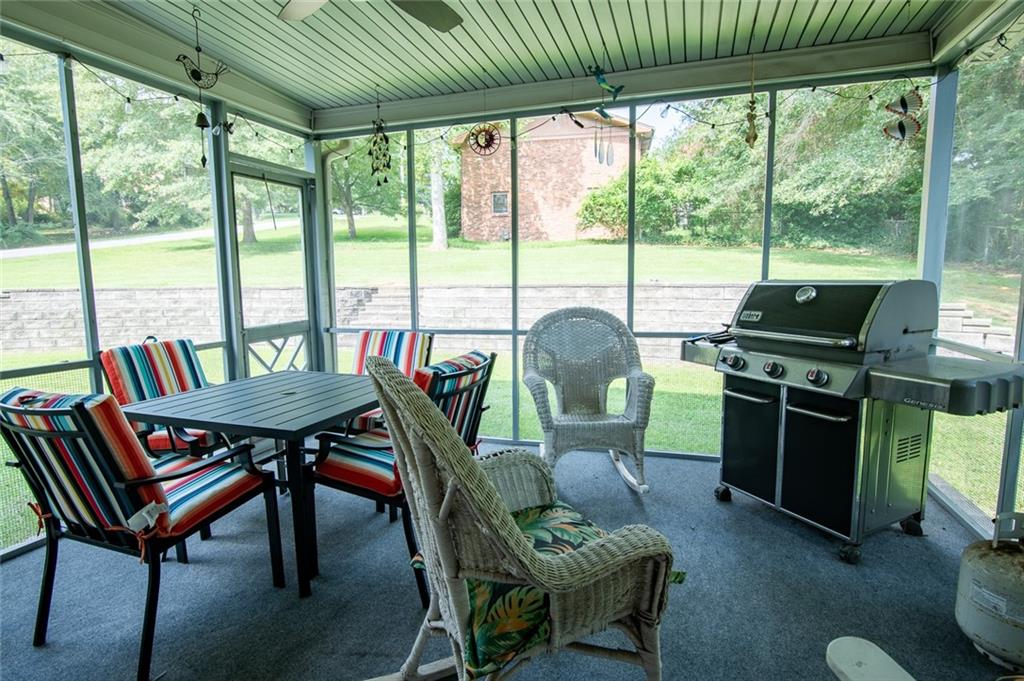 2966 Riviera Drive Conyers, GA 30012 - Photo 5 of 63 a view of a dining room with furniture large windows and wooden floor