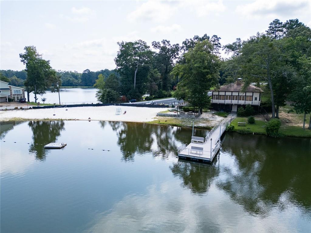 2966 Riviera Drive Conyers, GA 30012 - Photo 57 of 63 a view of a lake with a park with large trees