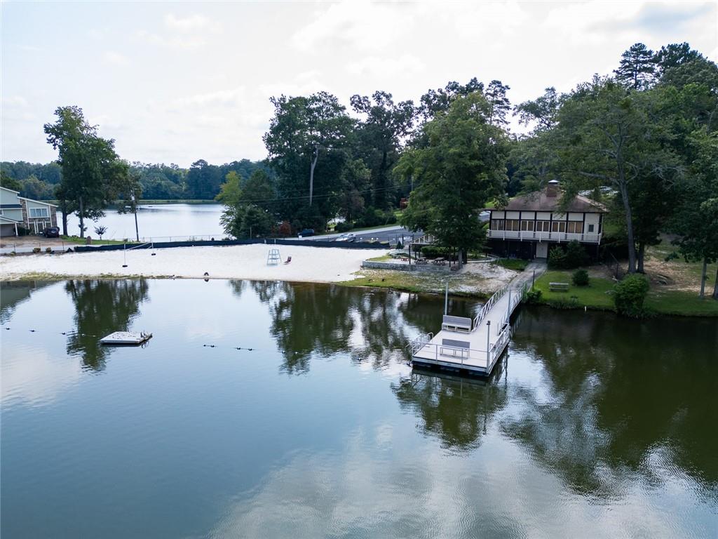 2966 Riviera Drive Conyers, GA 30012 - Photo 58 of 63 a view of a lake with a park with large trees