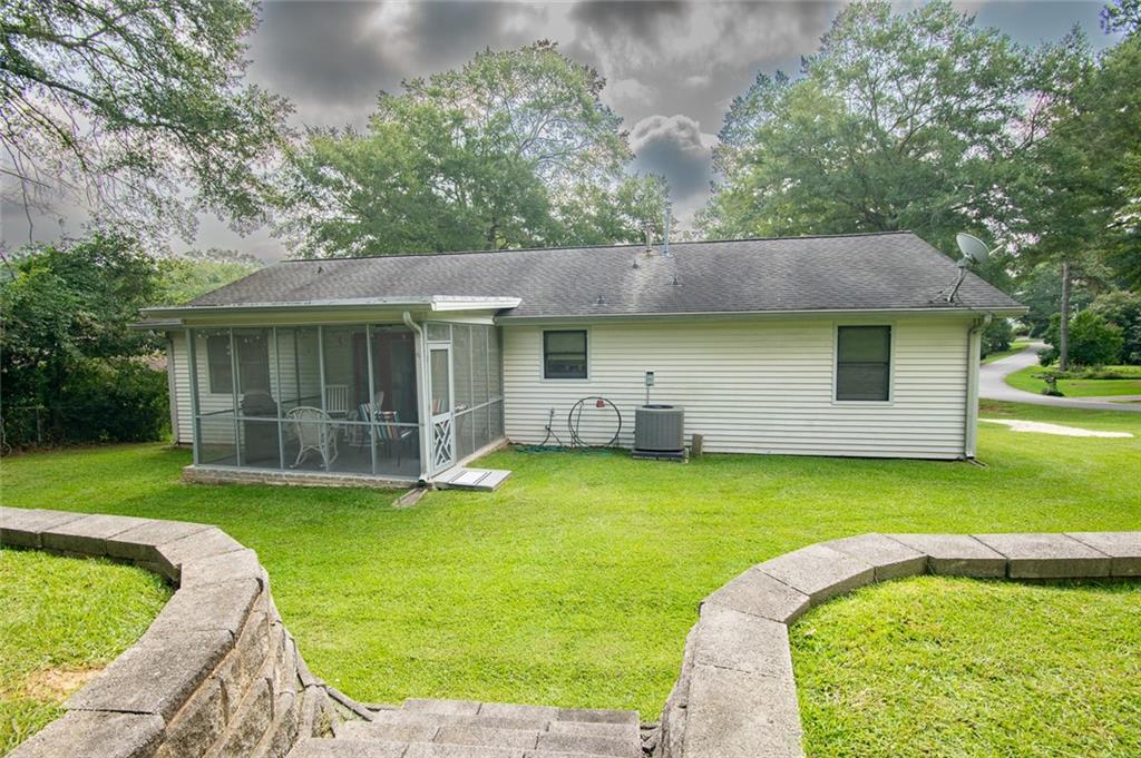 2966 Riviera Drive Conyers, GA 30012 - Photo 6 of 63 a front view of a house with garden