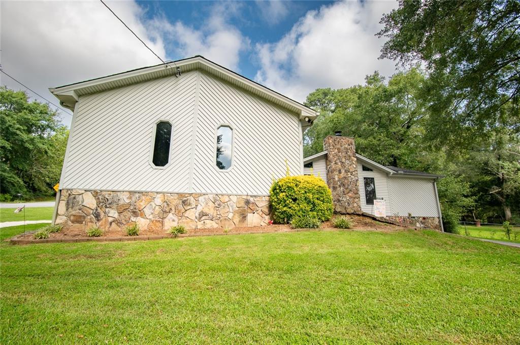 2966 Riviera Drive Conyers, GA 30012 - Photo 7 of 63 a sign that is sitting in the grass