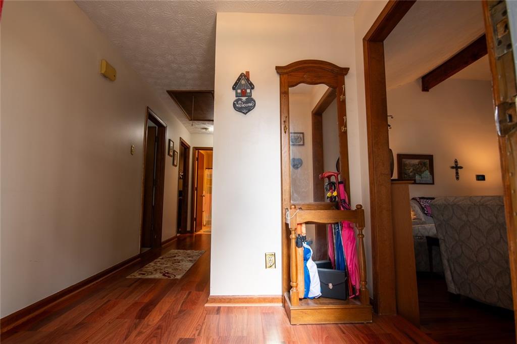 2966 Riviera Drive Conyers, GA 30012 - Photo 8 of 63 a view of a hallway with wooden floor and closet