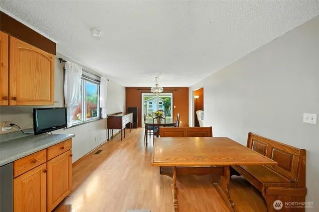 a view of a dining room with furniture and wooden floor