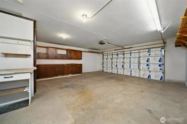 a view of an empty room with a garage