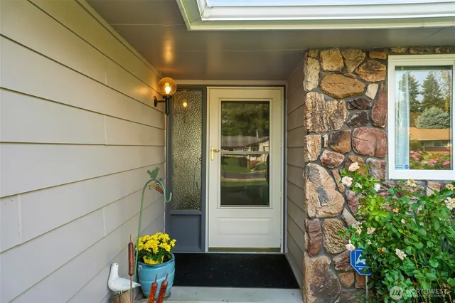 a front view of a house with outdoor seating