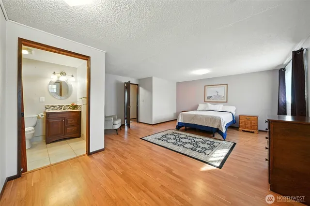 a living room with a bed furniture and a window