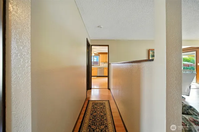 a view of gallery with wooden floor