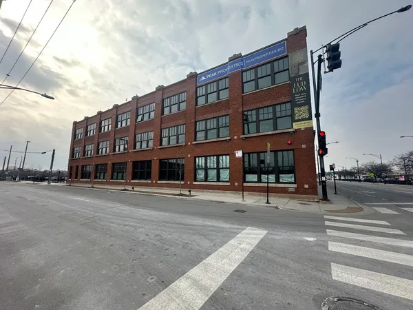 a view of a building with a street