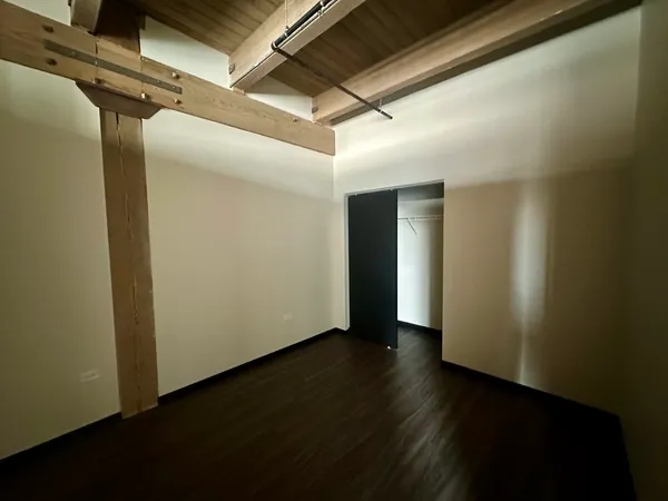 a view of hallway with wooden floor