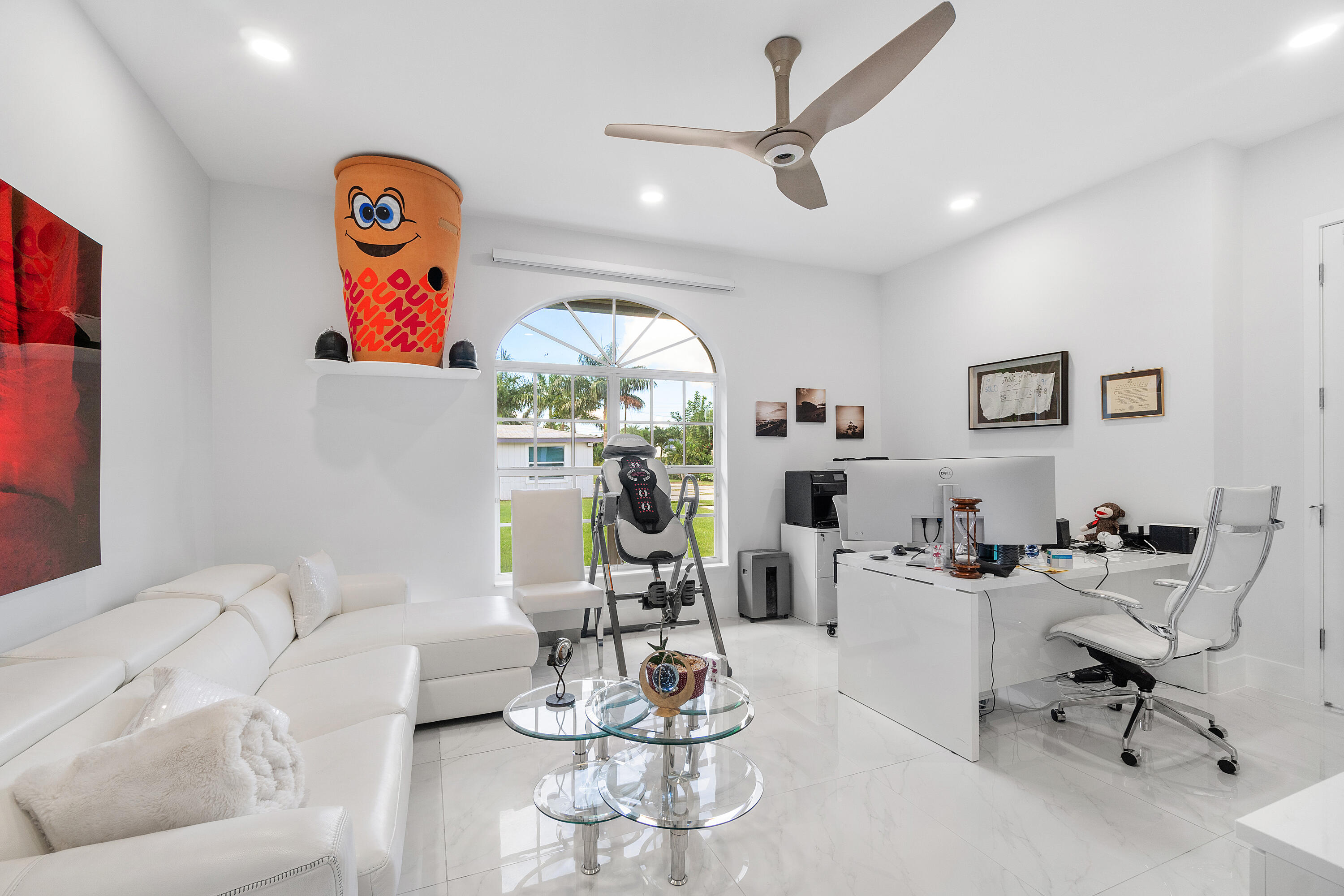 5447 Center Street Jupiter, FL 33458 - Photo 19 of 60 a living room with furniture and a chandelier
