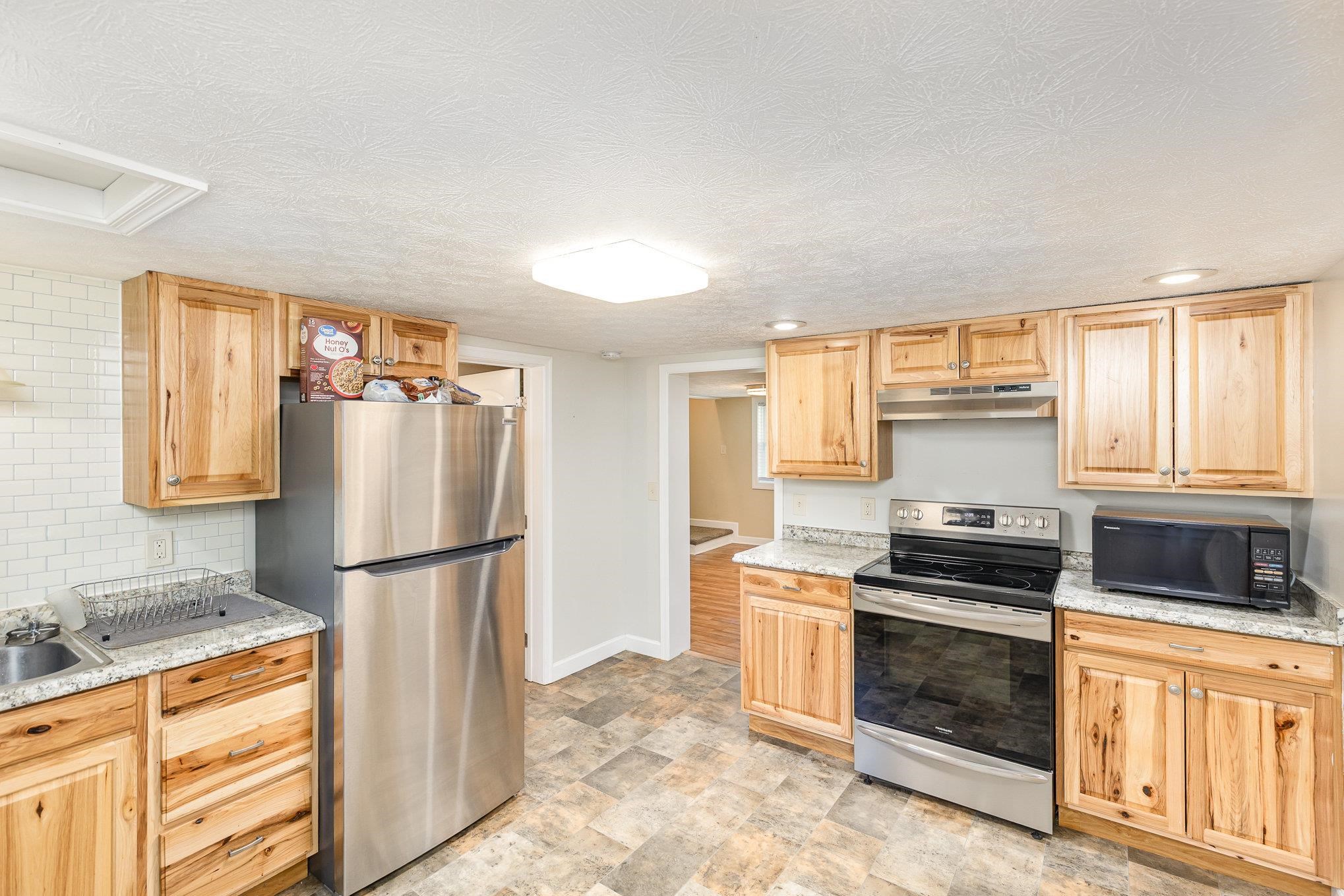 406 6th Street Luray, VA 22835 - Photo 11 of 28 a kitchen with a refrigerator stove and sink